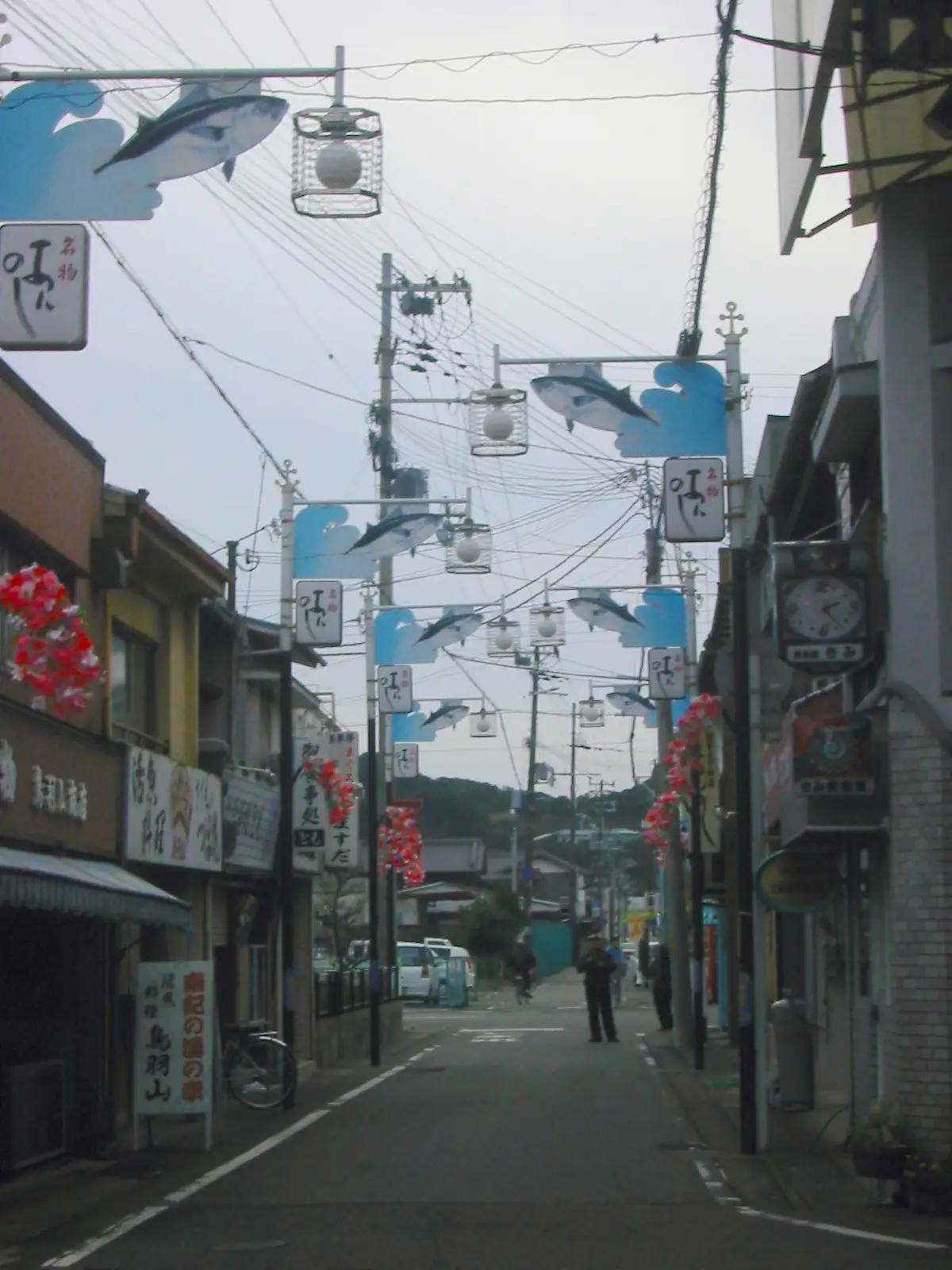 A Kii-Katsuura shopping street with tuna-shaped decorations on the street lamps