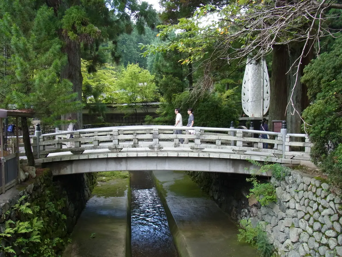 Ichi-no-hashi, the white stone bridge at the entrance to Okunoin, with cedars beyond